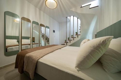 Posteľ alebo postele v izbe v ubytovaní Hermes Design Suites