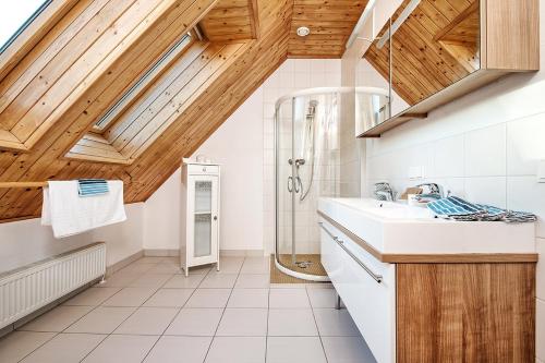 a bathroom with a sink and a shower at Haus Herzog in Tröpolach