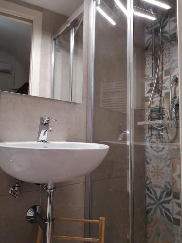 a bathroom with a sink and a shower at Alimarta in Monopoli
