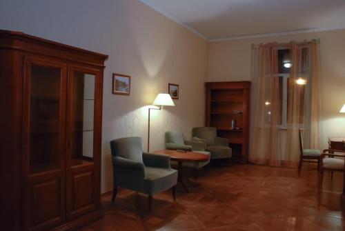 a living room filled with furniture and a fireplace at Central Apartments Lviv in Lviv