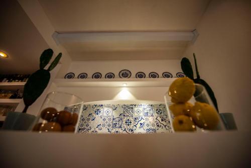 a kitchen with a stove with a bunch of fruit at Tenuta Tropeano in Tropea