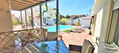 a balcony with a view of a swimming pool at Seixal Bay Village - Family Choice in Seixal
