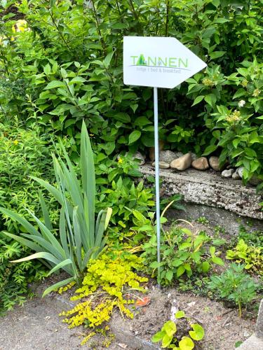 a sign that reads tammen in a garden at B&B tannen124 in Oberburg