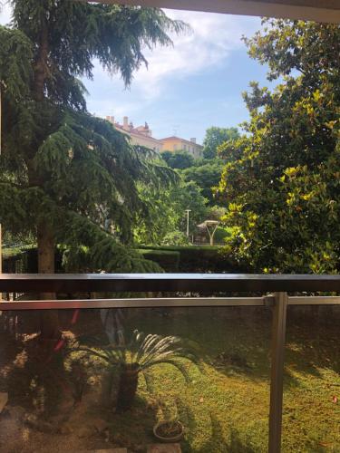 a view of a garden from a window at Cannes center in Cannes