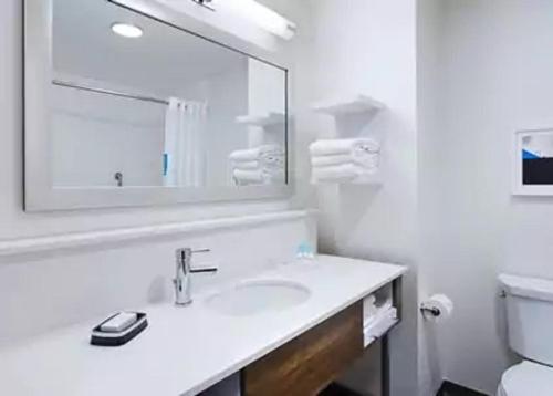 a white bathroom with a sink and a mirror at Hampton Inn by Hilton Wabash in Wabash