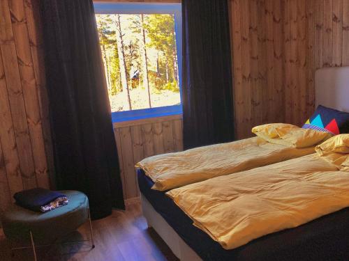 En eller flere senge i et værelse på Tuddal Hyttegrend HYTTA KÅNS