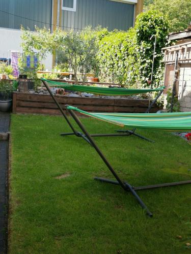 two hammocks sitting on the grass in a yard at Lisa in Bremm