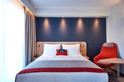 Кровать или кровати в номере Holiday Inn Express Amsterdam - City Hall by IHG