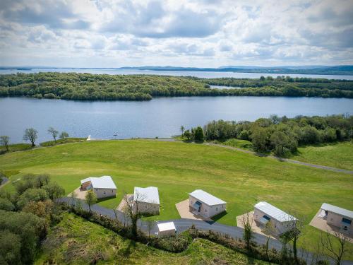 an aerial view of a house and a lake at Executive Lakeside Lodge at Mullans Bay in Kesh