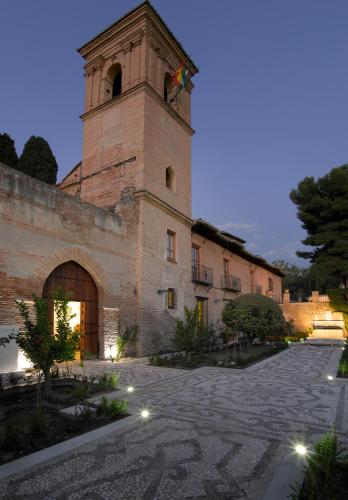 a building with a clock tower on top of it at Parador de Granada in Granada