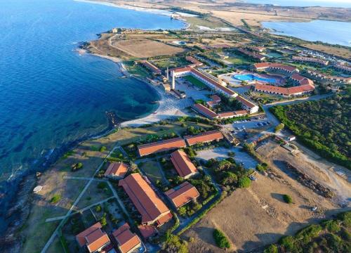 an aerial view of a resort near the ocean at La Tonnara House in Stintino