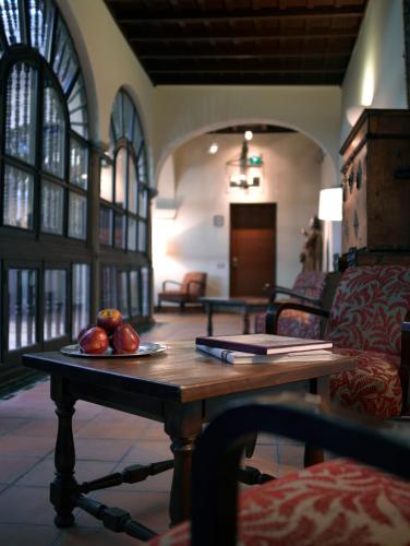 a table with fruit on it in a room at Parador de Granada in Granada