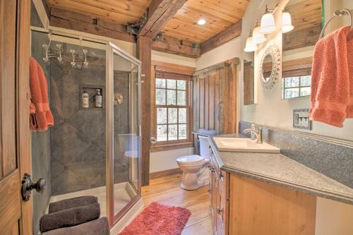 a bathroom with a shower and a sink and a toilet at Timeless Red Sox Retreat with Scenic Mountain Views! in Putney