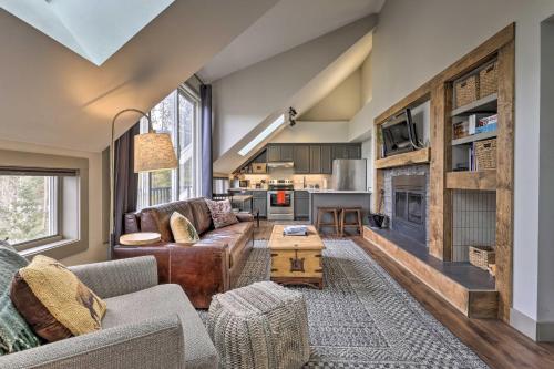 a living room with a couch and a fireplace at Hot Tub and Ski Shuttle Access Keystone Condo! in Keystone