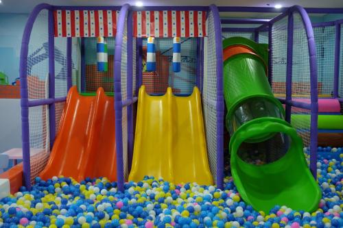 a playground filled with balls and slides at Wyndham Qingdao l Free Fixed-Time Shuttle Service Between Hotel and Airport & North Railway Station l Outdoor Children's Amusement Park l 1-Hour Play Snooker or Table Tennis in Qingdao