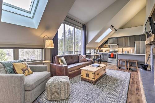 a living room with a couch and a table at Hot Tub and Ski Shuttle Access Keystone Condo! in Keystone