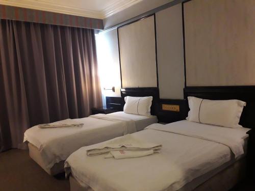Ένα ή περισσότερα κρεβάτια σε δωμάτιο στο Hotel Deleeton