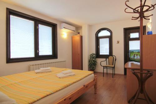 
A bed or beds in a room at Eco Apartments Plovdiv

