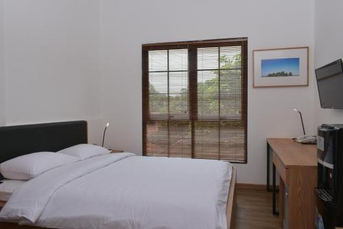 Postel nebo postele na pokoji v ubytování Rumanami Residence