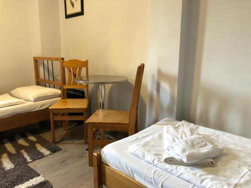 Postel nebo postele na pokoji v ubytování Borostyán 20 Vendégház