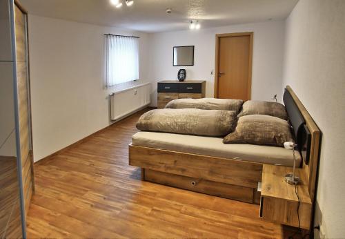 a bedroom with two beds in a room at Albglück in Gammertingen