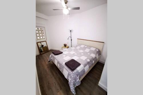 a bedroom with a bed and a ceiling fan at Holiday Apartment Mariola in Calpe