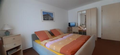 מיטה או מיטות בחדר ב-Ferienwohnung im Prossner Gründel