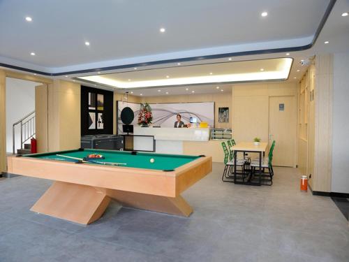 a living room with a pool table in it at Up And In Rizhao Wulian County Wulian Square in Rizhao