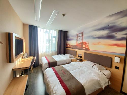 a hotel room with two beds and a painting on the wall at Thank Inn Chain Hotel Taiyang Yingze District Xiyang City Market City Hall in Taiyuan
