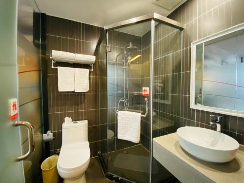 a bathroom with a toilet and a sink at Thank Inn Chain Hotel Jiangsu Suzhou High-tech Zone Majian Xintiandi in Suzhou