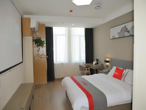 Katil atau katil-katil dalam bilik di JUN Hotels Shandong Liaocheng Eco-Tech Development Zone Contmporary International Plaza