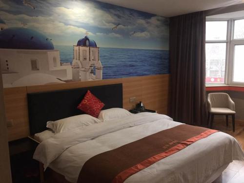 a bedroom with a large bed with a painting of the ocean at JUN Hotels Henan Luoyang Xigong District Central Bus Station in Luoyang