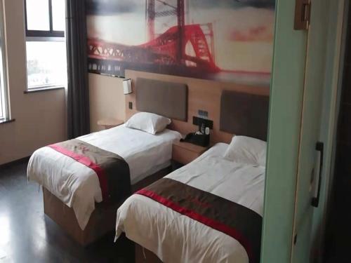 Ένα ή περισσότερα κρεβάτια σε δωμάτιο στο Thank Inn Chain Hotel Xinxiang Yuanyang Jianshe Road Hualong Shangjun