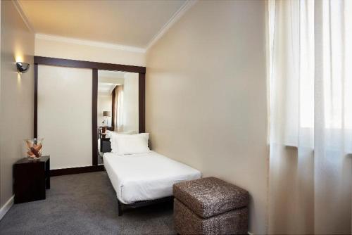 Katil atau katil-katil dalam bilik di Hotel As Americas
