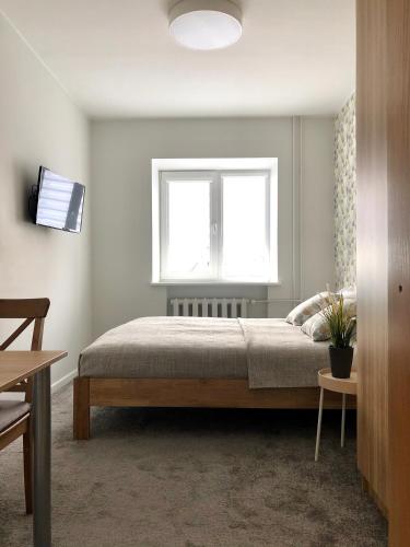 Letto o letti in una camera di COMFY Patogūs namai