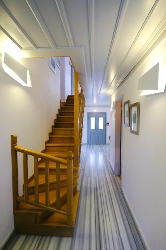 a hallway with stairs in a building at Limnos Experience in Mirina