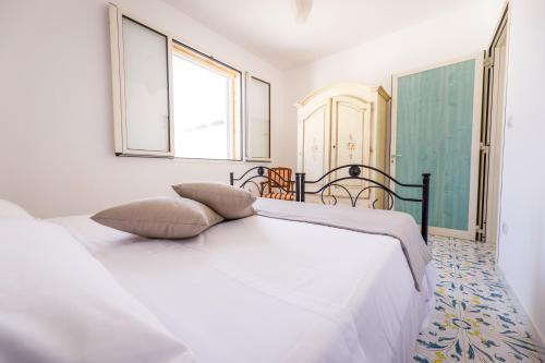 Postel nebo postele na pokoji v ubytování Callistos Apartment Pescoluse