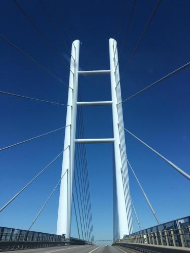 a tall white bridge against a blue sky at Ferienwohnung "Kranich" im Ferien-Resort Rügen in Sagard