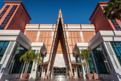 a building with a pyramid in front of it at Holiday World Polynesia in Benalmádena