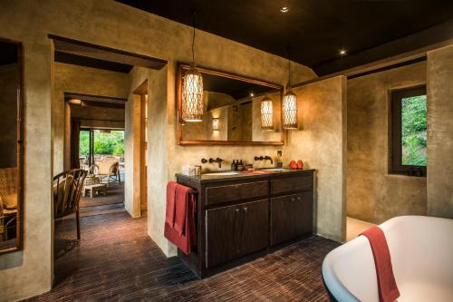 a kitchen with a sink and a counter at Zannier Hotels Bai San Hô in Song Cau