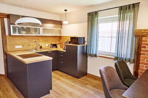 a kitchen with a sink and a counter top at Ferienwohnungen Wald und Wiese in Waldkirchen
