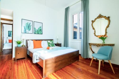 En eller flere senge i et værelse på Piazza Chiappa Apartment