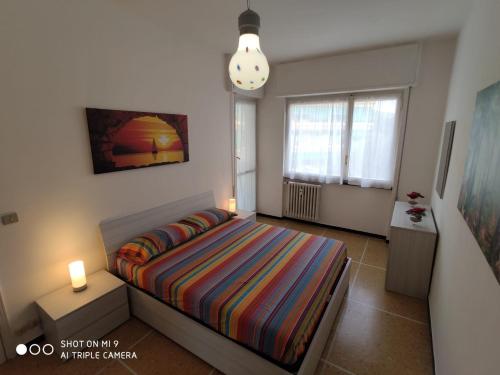 En eller flere senge i et værelse på Casa di Teo