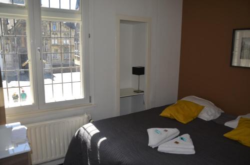 Кровать или кровати в номере B&B De Hofnar Maastricht
