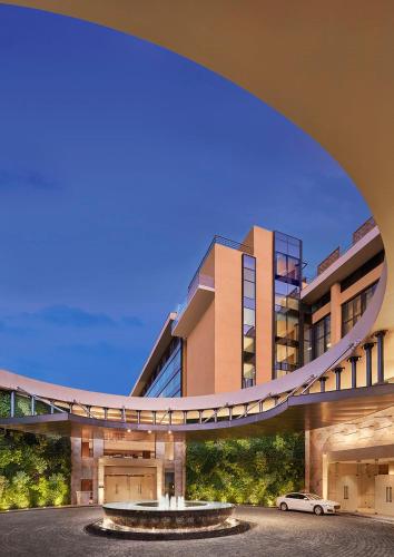 a building with a car parked in front of it at Taj Cidade de Goa Horizon, Goa in Panaji