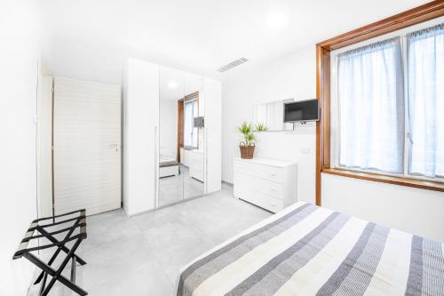Ein Bett oder Betten in einem Zimmer der Unterkunft Como City Home