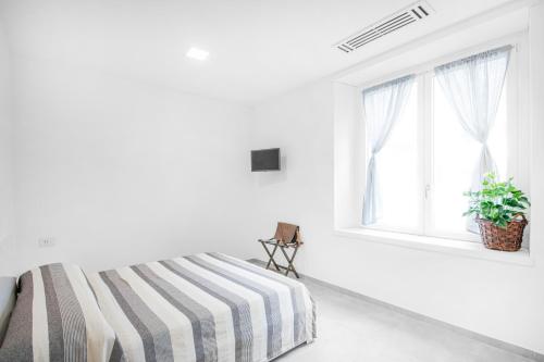 Ein Bett oder Betten in einem Zimmer der Unterkunft Como City Home