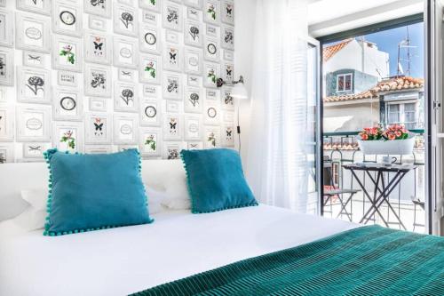 Ένα ή περισσότερα κρεβάτια σε δωμάτιο στο Alfama Best Balcony