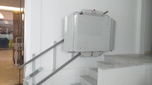 a white refrigerator sitting on top of a white wall at HI Évora – Pousada de Juventude in Évora