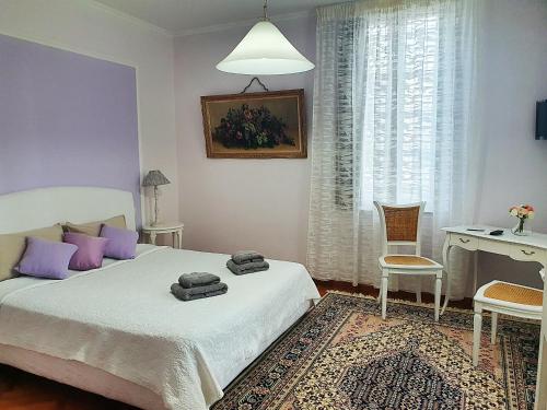 Postel nebo postele na pokoji v ubytování Miglioranzi Rooms